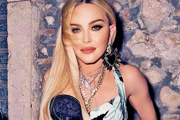 Madonna flashes bare bust in risque video after begging trolls to stop bullying her mastram